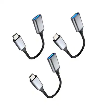 The image shows four USB-C to USB-A adapters.