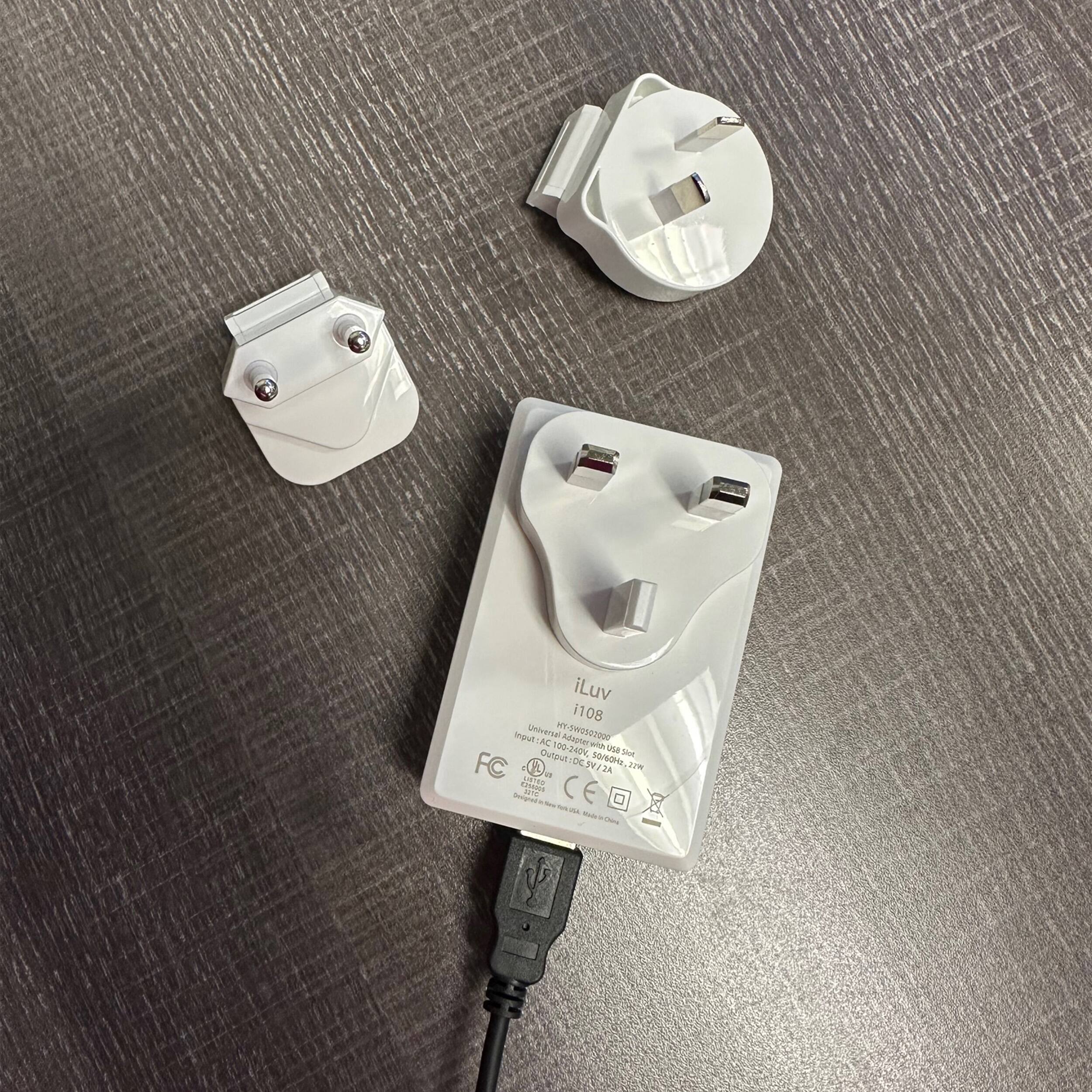 iLuv i108 11 P  unovental PeTecowD3 AC ARe uN Output 00-340V, SAR FC R uteul:DC.3V/2A DC.PV TV 10/6, A Vds a - JA Pergrul S - CE