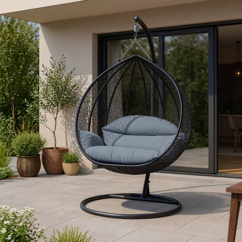 Angle. LeisureMod - Recluse Modern Wicker Teardrop Hanging Egg Chair with Stand - Outdoor Indoor Swing Chair & Cushion - Charcoal Blue.