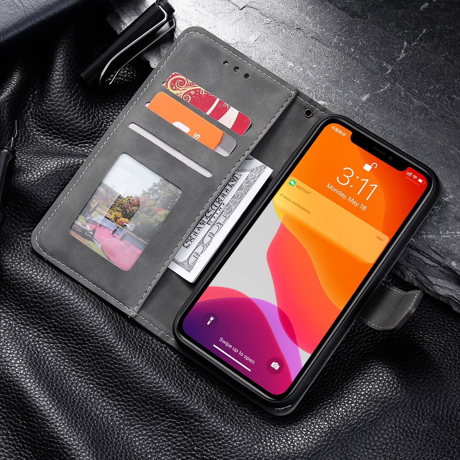 3:11 Monday, May 18  
4 more WECHAT notifications  
Swipe up to open
