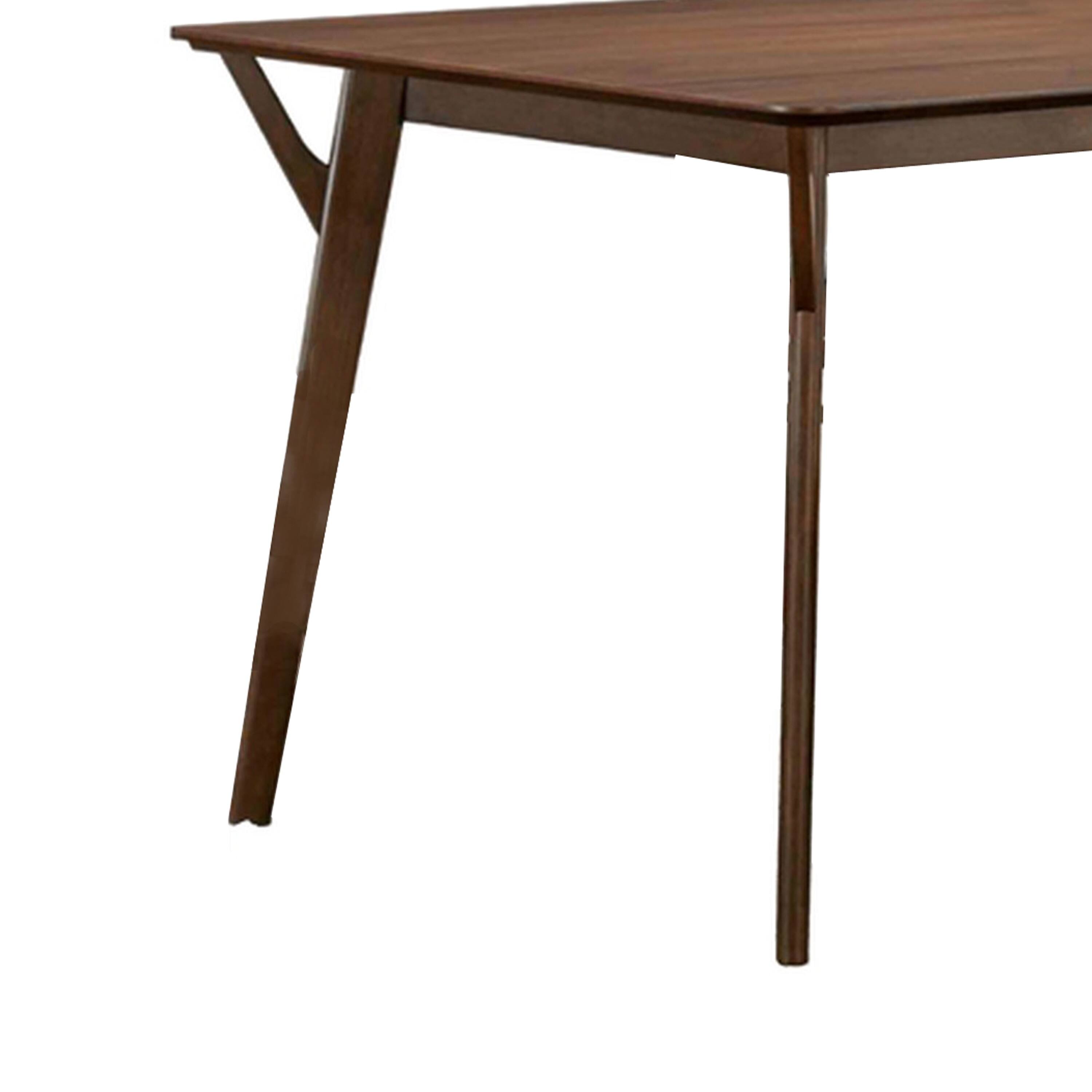 Alt View 3. Manhattan Lane - Skie Dining Table, 59 Inch Rectangular Top, Angled Legs, Brown Solid Wood - Walnut Brown.