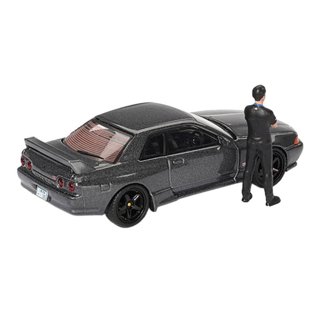 Left. Mini GT - Nissan Skyline GT-R (R32) RHD (Right Hand Drive) Gunmetal Gray Metallic with Tsugio Matsuda Figure Limited Edition 1/64 - Gunmetal Gray.