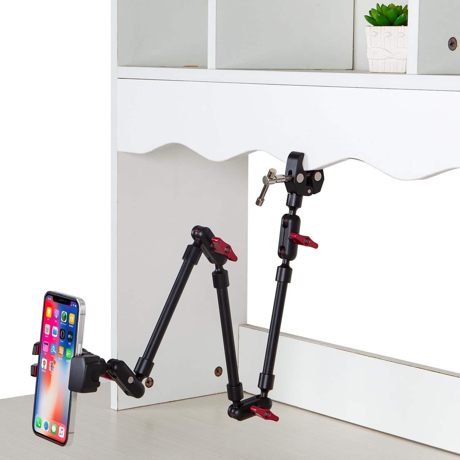 Front. PARKER SLATER - Adjustable articulating magic arm with clamp and phone holder clip for desk mount, stand, or tripod use. - Black.