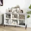 The image features a white bookshelf filled with various items, including books, decorative objects, and a vase. The books are arranged in different sections on the shelf, and there is a potted plant nearby. The bookshelf is located in a room with a chair, and the overall scene is well-organized and visually appealing.