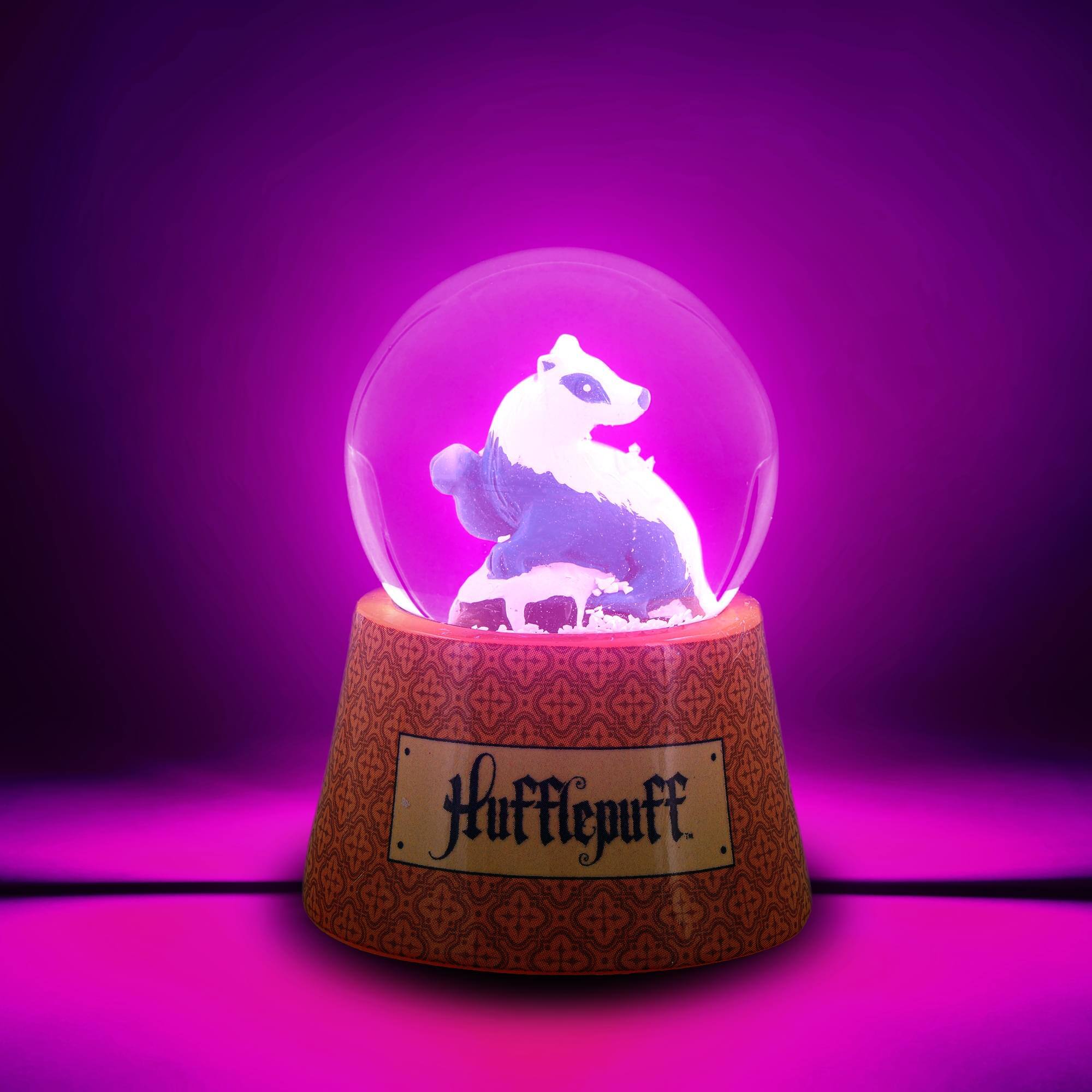 Alt View 1. Silver Buffalo - Harry Potter House Hufflepuff 3-Inch Mini Light-Up Snow Globe - Orange.