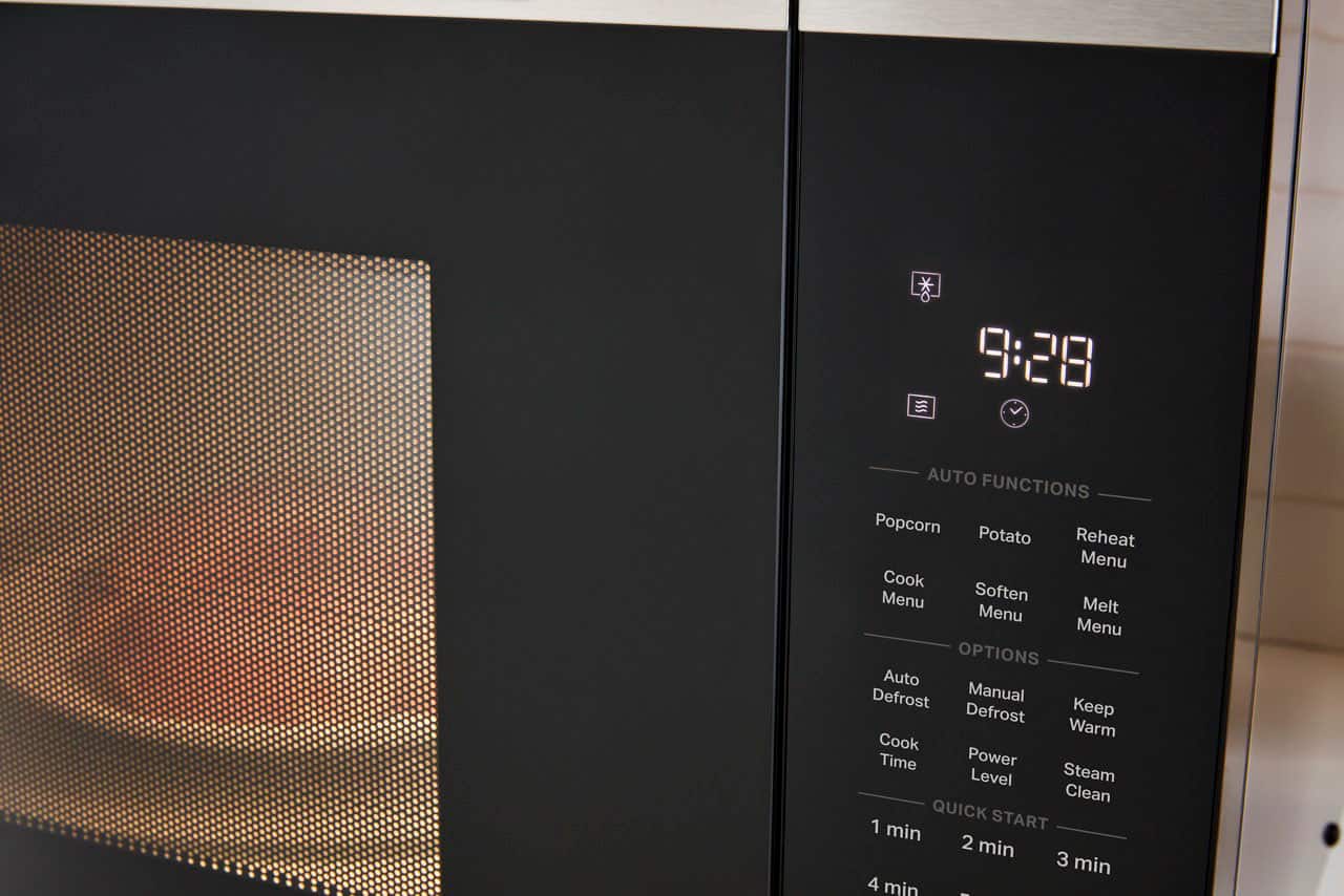 The text on the image reads:
9:28 Auto Functions
Popcorn
Potato
Reheat
Menu
Cook Menu
Soften Menu
Melt Menu
Options:
Auto Defrost
Manual Defrost
Keep Warm
Cook Time
Power Level
Steam Clean
QUICK START
1 min
2 min
3 min
4 min
-