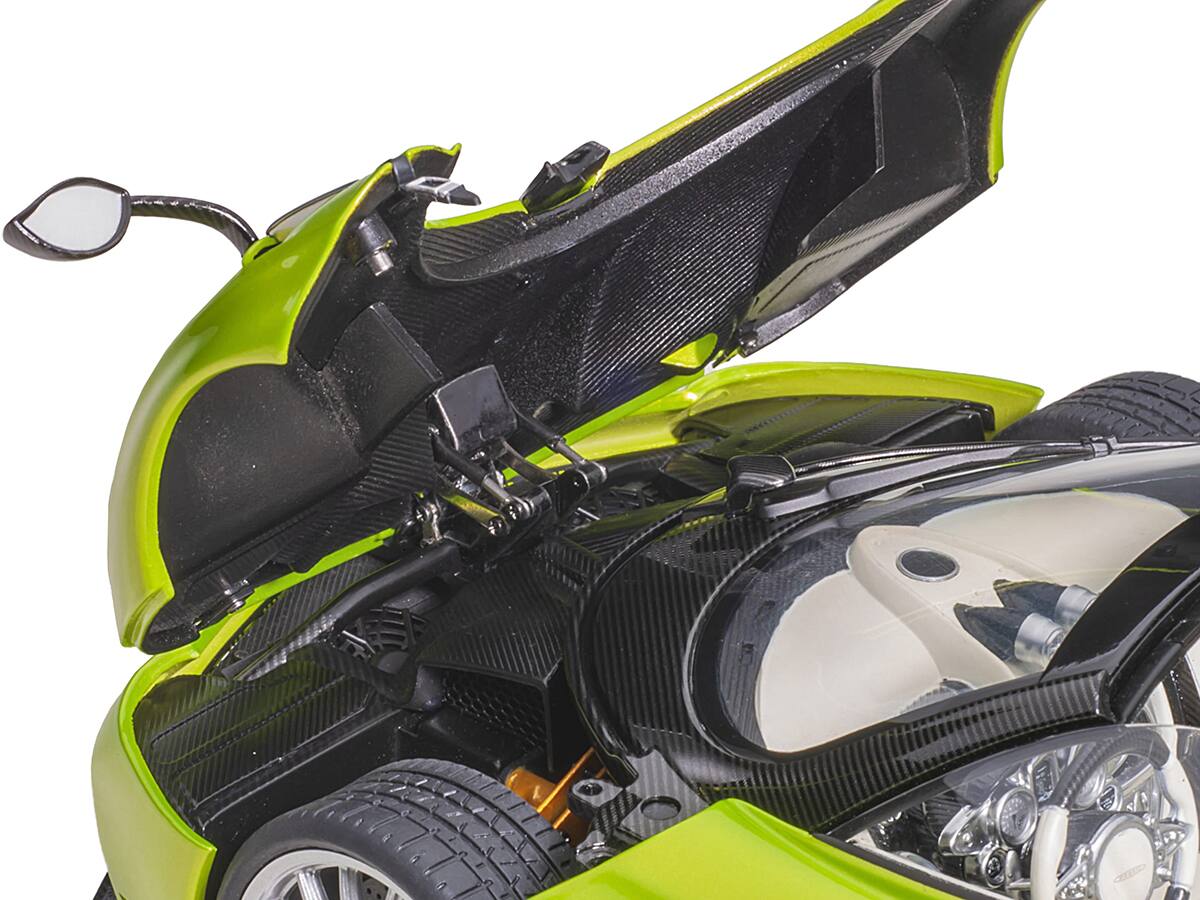 Left. Autoart - Pagani Huayra Roadster Verde Firenze Green Metallic and Carbon with Luggage Set 1/18 Model Car by Autoart - Green Metallic And Carbon.