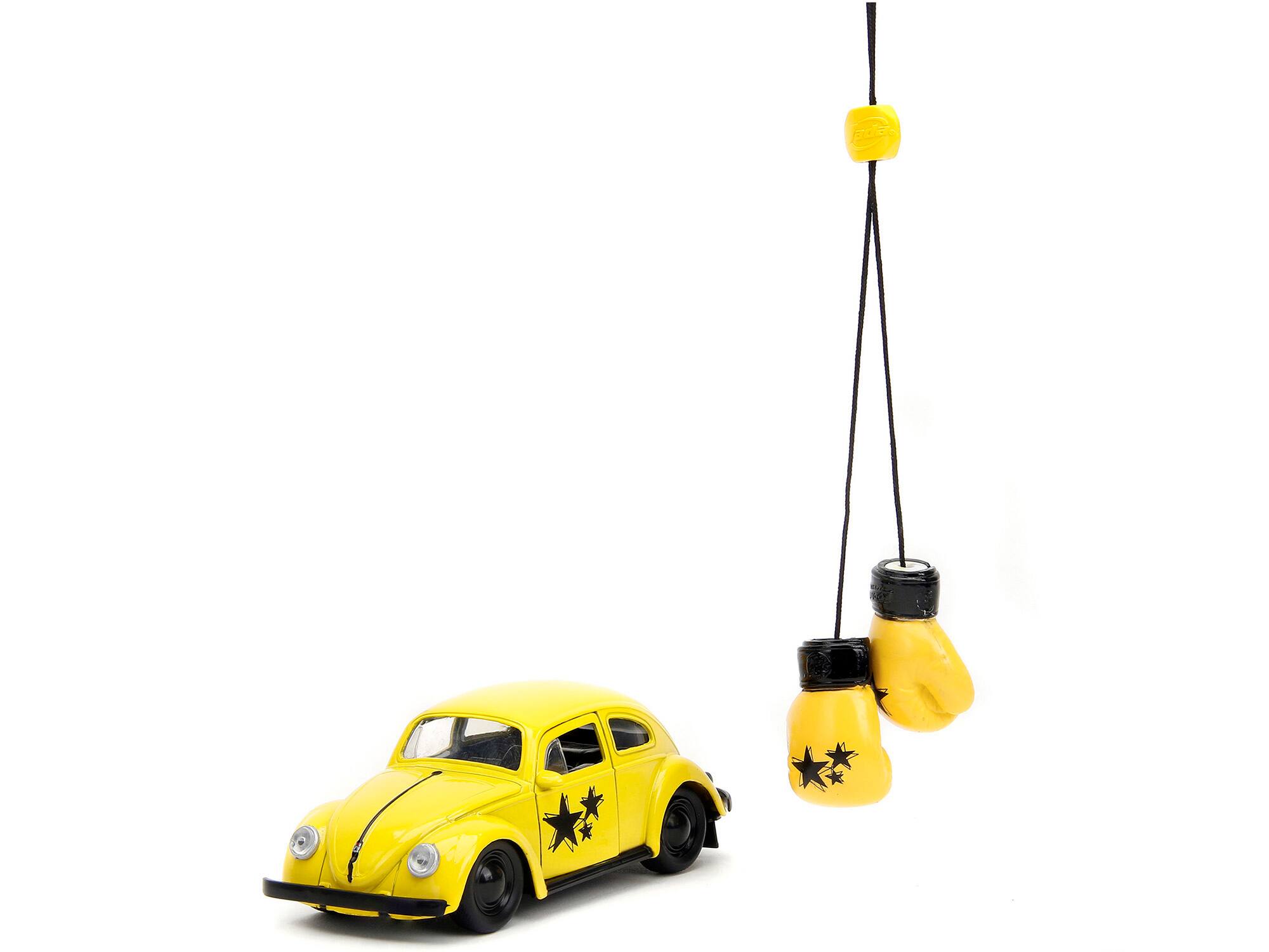 Angle. Jada - 1959 Volkswagen Beetle Yellow with Black Graphics and Boxing Gloves Accessory "Punch Buggy" Series 1/32 - Yellow With Black.