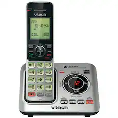 CHARGE
vtech
UTECH
800-595-95 11
ECO
10:08 PM 12/30
REDIAL PAUSE MENU SELECT VOLUME TALK FLASH CID OFF CANCEL
1 GHI 4 PORS 7 TONE ABC 2 JKL 5 TUV 8 OPER 0 DEF 3 MNO 6 WIYZ 9 QUIET # 0
DIGITAL ANSWERING SYSTEM IN USE DELETE p ENGT FAA x REPEAT 12 SKIP MUTE DELETE INT FIND PLAY/STOP HANDSET ANS ON/OFF VOL- VOL++
vtech