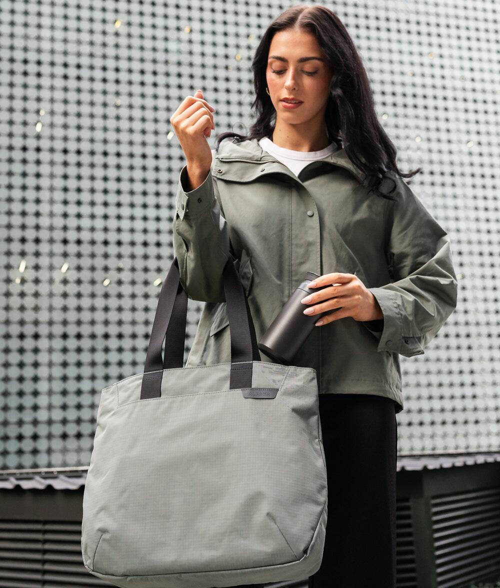 Left. ALPAKA - Tote Bag Minimalist EDC Travel Tote,14.5L , 2 Bottle Sleeves, Front/Back Slip Pockets, Magnetic Open-Top (No Zipper) - Grey/G Axoflux 210D.