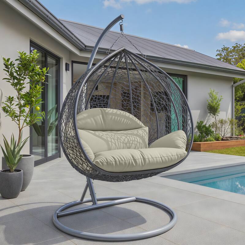 Angle. LeisureMod - Recluse Grey Wicker Hanging Egg Chair - Modern Indoor Outdoor Swing with Stand, 440lb Capacity - Taupe.