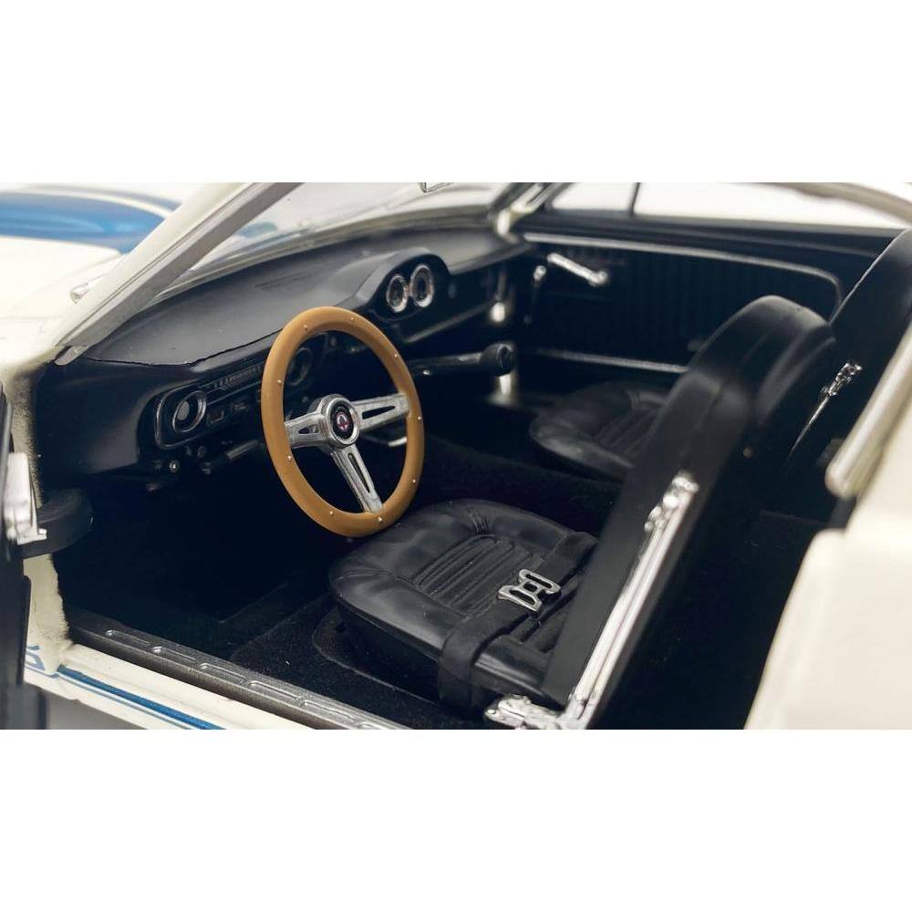 Left. ACME - 1965 Shelby GT350 "Reynolds Ford" White with Blue Stripes Limited Edition to 204 pieces Worldwide 1/18 - White.