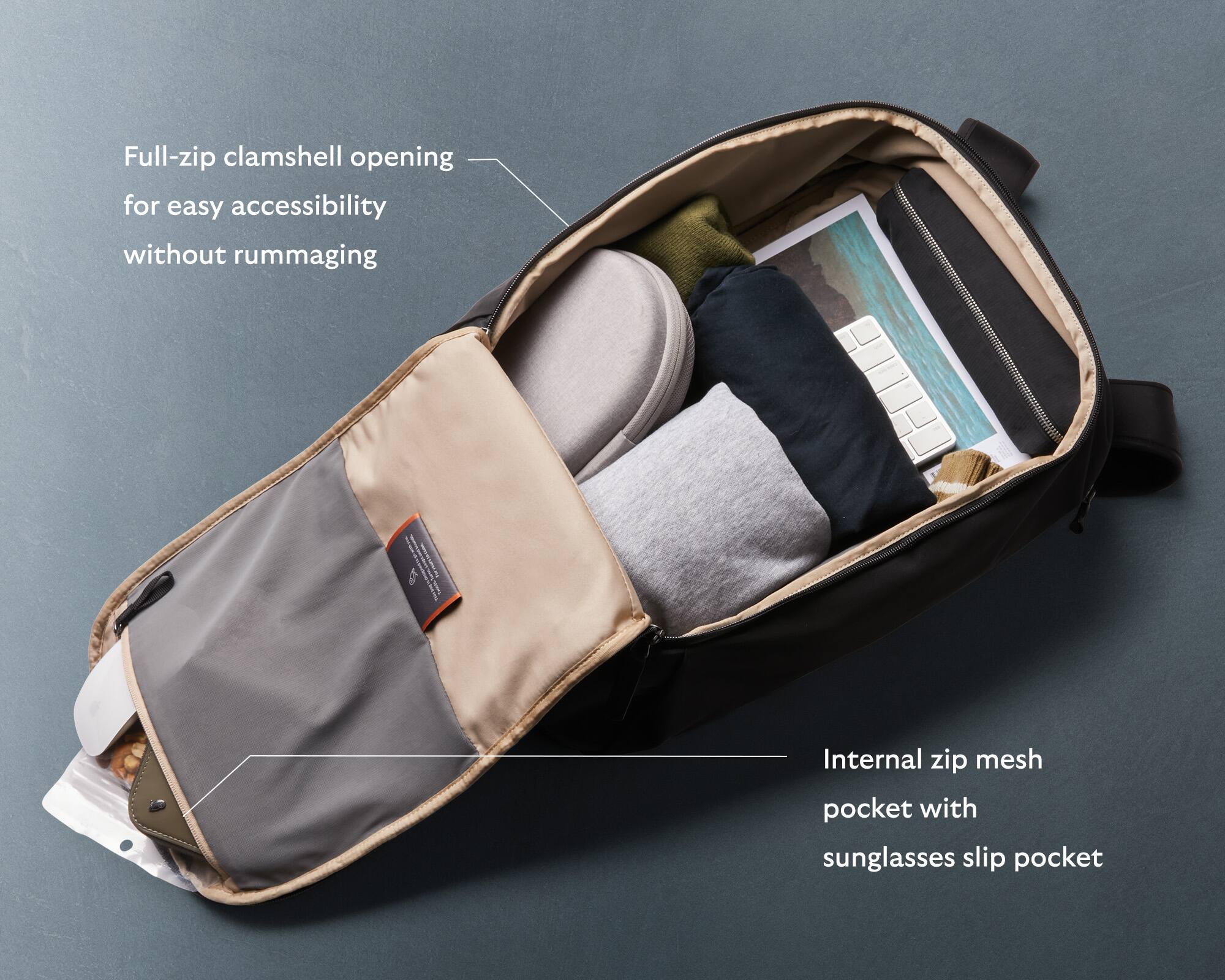 Full-zip clamshell opening for easy accessibility without rummaging. Internal zip mesh pocket with sunglasses slip pocket.