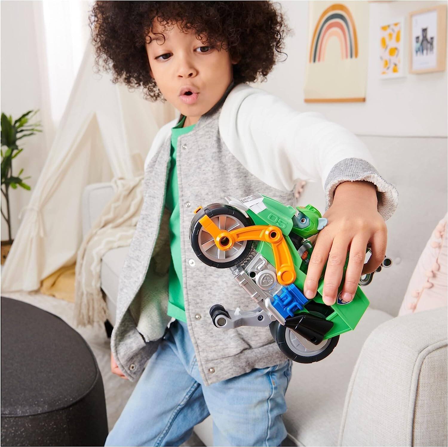 Left. Paw Patrol - Paw Patrol Moto Pups Rocky Deluxe Pull-Back Motorcycle with Wheelie Feature and Figure, Ages 3+ - Multicolor.