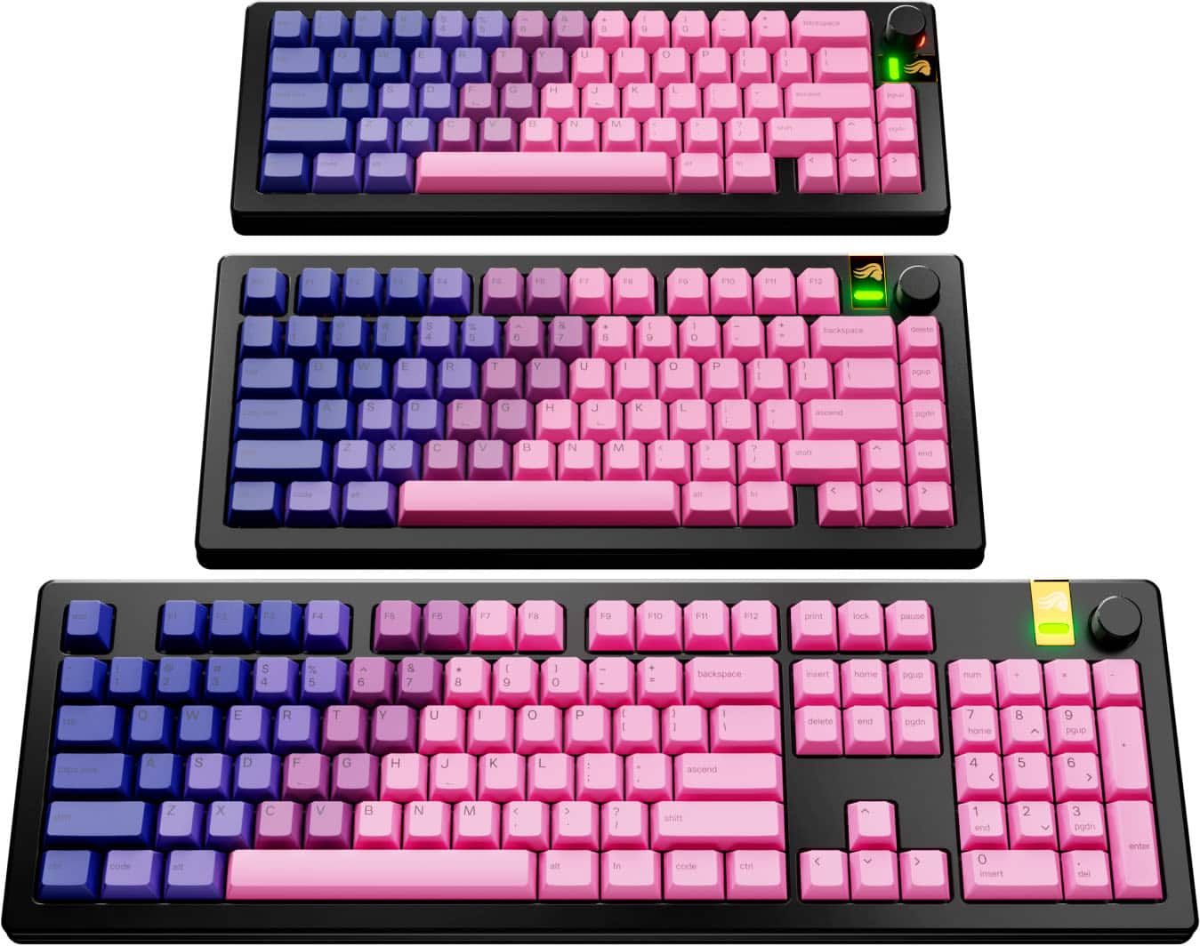 There are three keyboards displayed in the image. The first keyboard has a blue and pink color scheme, the second keyboard has a pink and purple color scheme, and the third keyboard has a purple and pink color scheme. Each keyboard has a unique color combination, making them visually distinct from one another.