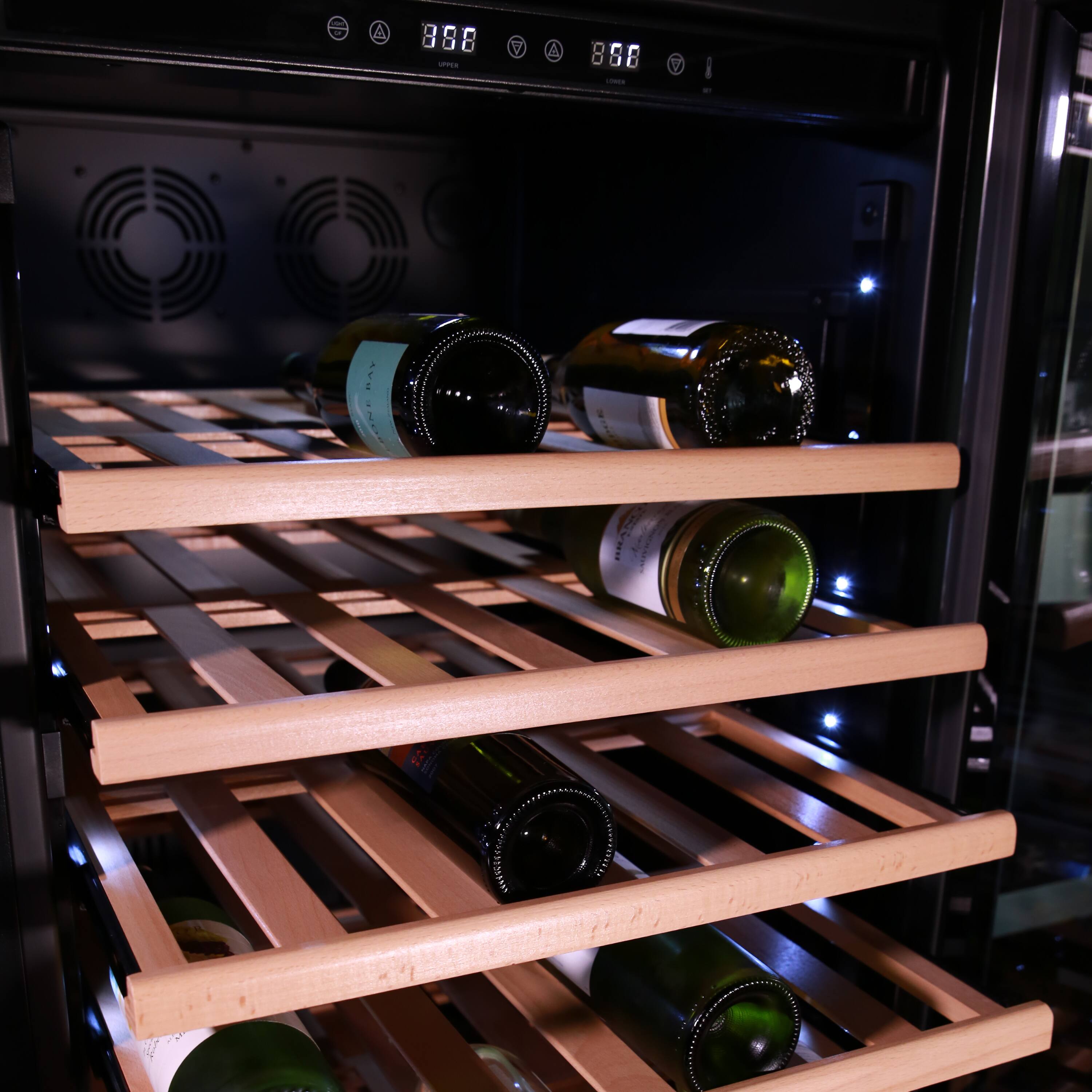 The image shows a wine rack with a total of 12 bottles of wine. The wine rack is filled with various types of wine bottles, and it is placed inside a wine refrigerator. The bottles are arranged in a neat and orderly manner, with some bottles placed on the top shelf and others on the bottom shelf. The wine refrigerator is designed to keep the wine at the optimal temperature and humidity, ensuring that the wine remains in the best possible condition for consumption.