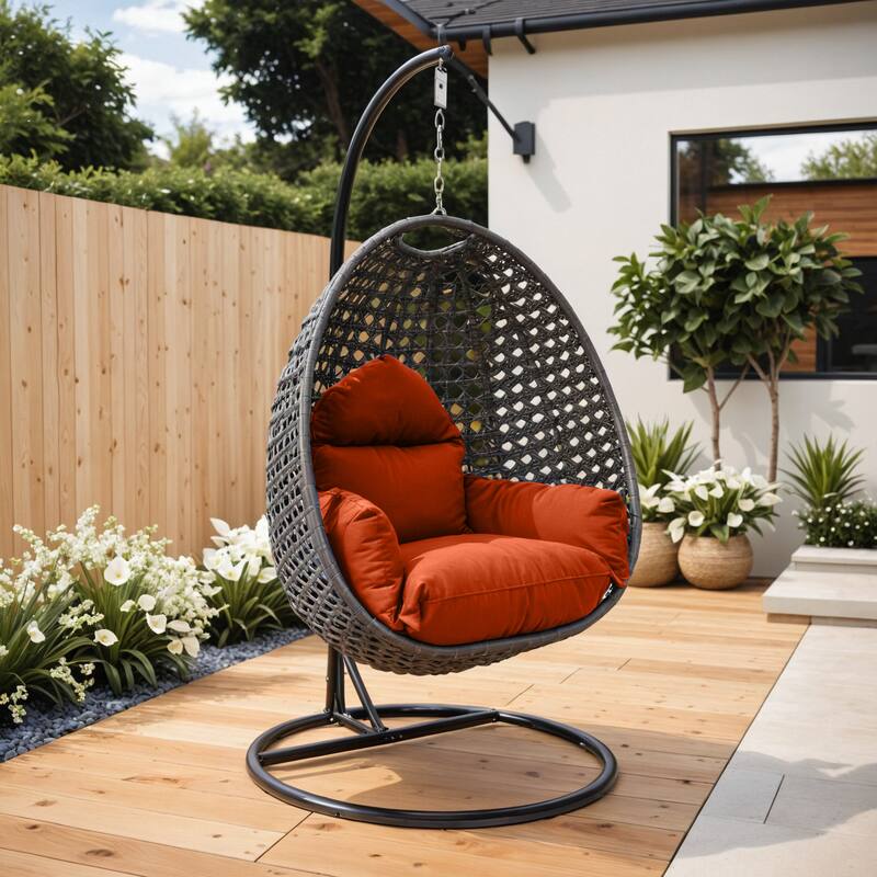 Angle. LeisureMod - LeisureMod Charcoal Wicker Outdoor Egg Swing Chair with Steel Stand - UV & Rust Resistant Single Seat for Patio - Orange.