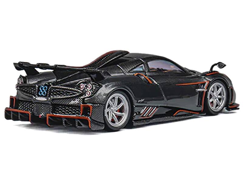 Left. CM Models - Pagani Imola Dark Gray Metallic with Carbon and Orange Accents with Extra Wheels 1/64 Diecast Model Car by CM Model - Dark Gray Metallic.