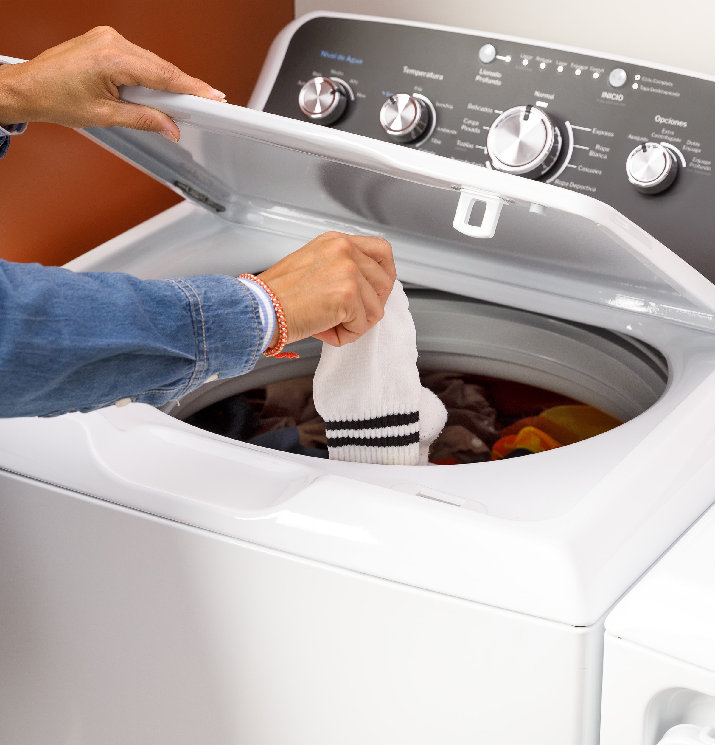 Alt View 17. GE - 4.5 Cu. Ft. High-Efficiency Top Load Washer with Spanish Control Panel - White with Matte Black.