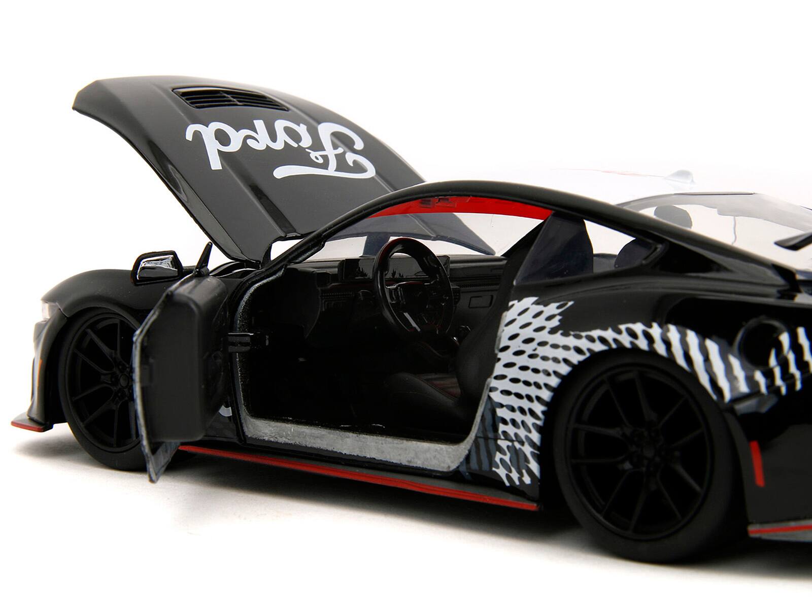 Alt View 2. Jada - 2024 Ford Mustang Dark Horse Black with White Top and "Mustang Horse Graphics" 1/24 Die Cast Model Car by Jada - Multicolor.