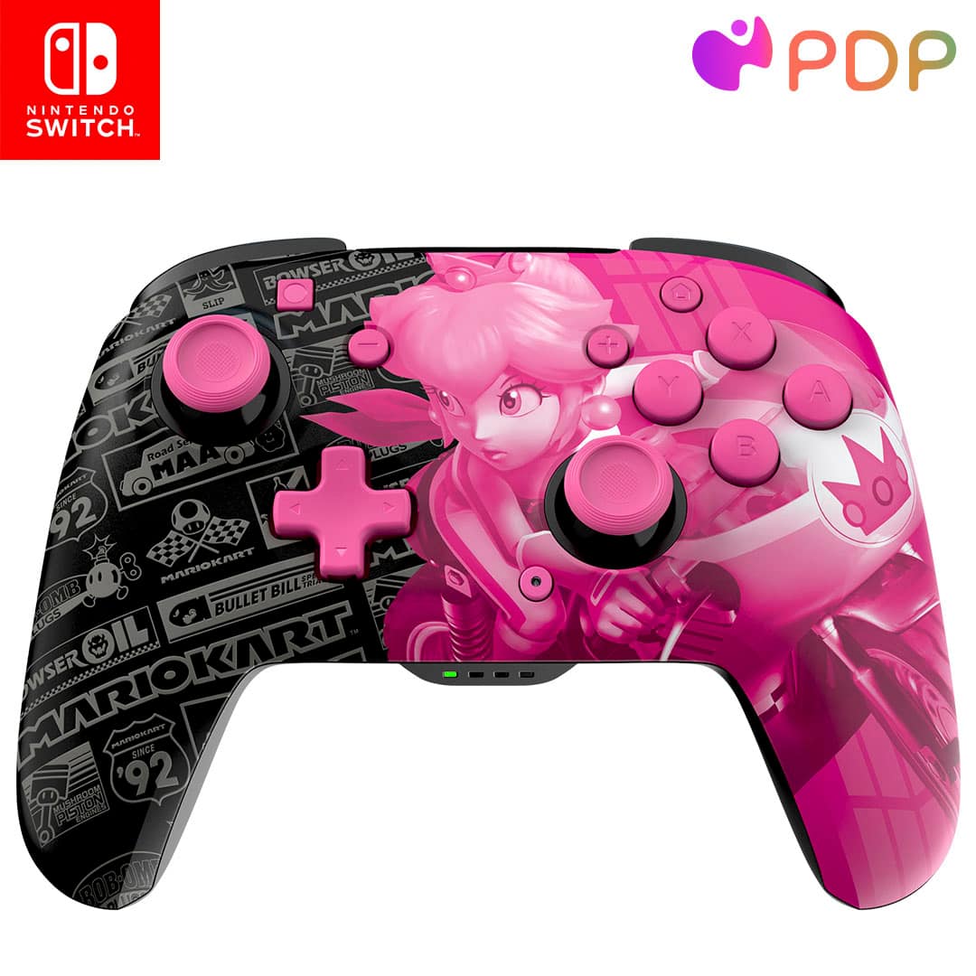 The image features a pink and black Nintendo Switch game controller with Mario Kart characters on it. The controller is designed with a pink color scheme and has a picture of a woman on it. The controller is compatible with the Nintendo Switch gaming system.
