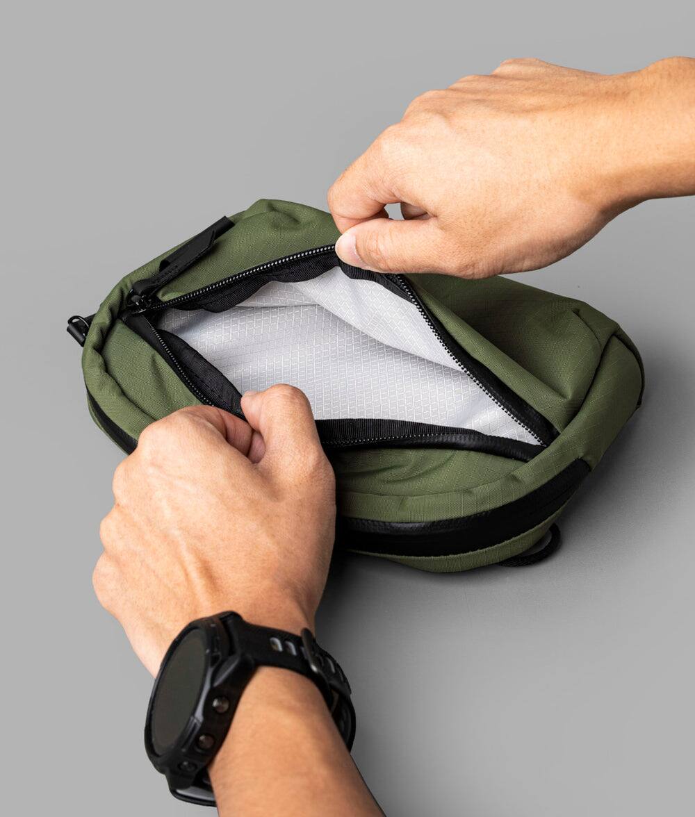 Alt View 8. ALPAKA - Flight Sling 1L Lightweight Crossbody Phone Bag for Travel, Passport Pocket, Weather-Resistant - Green Axoflux 210D.