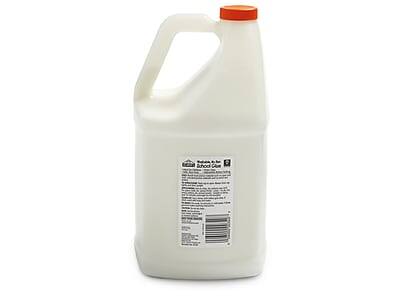 The text on the image reads:

"National School Supply
School Supply
1 Gallon
100% Pure
Distilled White Vinegar
5% Acetic Acid
Non-Toxic
Dilute 1 part vinegar to 4 parts water for general cleaning
Dilute 1 part vinegar to 1 part water for glass and mirror cleaning
Dilute 1 part vinegar to 2 parts water for wood and tile cleaning
Dilute 1 part vinegar to 3 parts water for carpet cleaning
Dilute 1 part vinegar to 4 parts water for fabric cleaning
Dilute 1 part vinegar to 5 parts water for toilet bowl cleaning
Dilute 1 part vinegar to 6 parts water for sink and tub cleaning
Dilute 1 part vinegar to 7 parts water for floor cleaning
Dilute 1 part vinegar to 8 parts water for window cleaning
Dilute 1 part vinegar to 9 parts water for shower and bath cleaning
Dilute 1 part vinegar to 10 parts water for refrigerator cleaning
Dilute 1 part vinegar to 11 parts water for dishwasher cleaning
Dilute 1 part vinegar to 12 parts