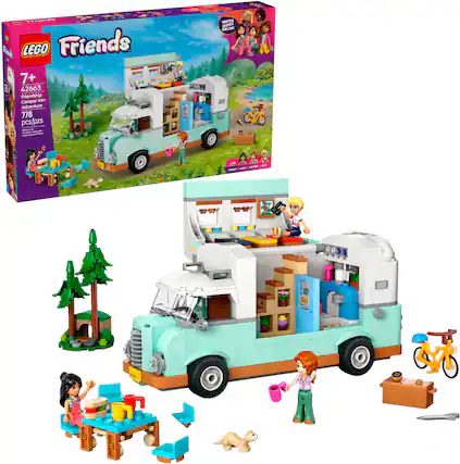 The image features a LEGO Friends set, which includes a camper and a truck. The set is designed for children aged 7+ and has 42663 pieces. The camper is white and blue, and it is accompanied by a truck. There are also several people and a dog in the scene, adding to the playful atmosphere. The set is available for purchase online.