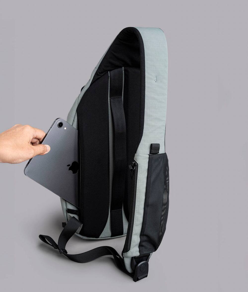 Alt View 5. ALPAKA - Crossbody Sling Bag 7.5L (Left Shoulder) for Men, Fits 11" Tablet, Phone Sleeve, Bottle Pocket, Luggage Pass-Through - Grey Axoflux 210D.