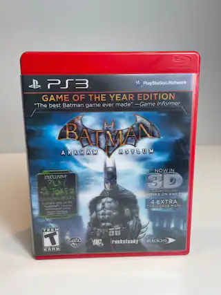PS3 PlayStation.Network GAME OF THE YEAR EDITION "The best Batman game ever made" -Game Informer BATMAN ARKHAM ASYLUM NOWIN IN 3D EXCLUSIVE PLAY THE JOKER CLASSES INCLUDED THE WORKS ON ANY TV CHALLENGE MAPS Available ONly ON the PlayStation 4 EXTRA computer CHALLENGE MAPS entertainment system iguires Broadbawd traet CoNMECTON TEEN T TE MINS ESRB DC rocksteady Eidos - T (Teen 13+)