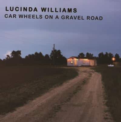 Front. Car Wheels on a Gravel Road [LP].