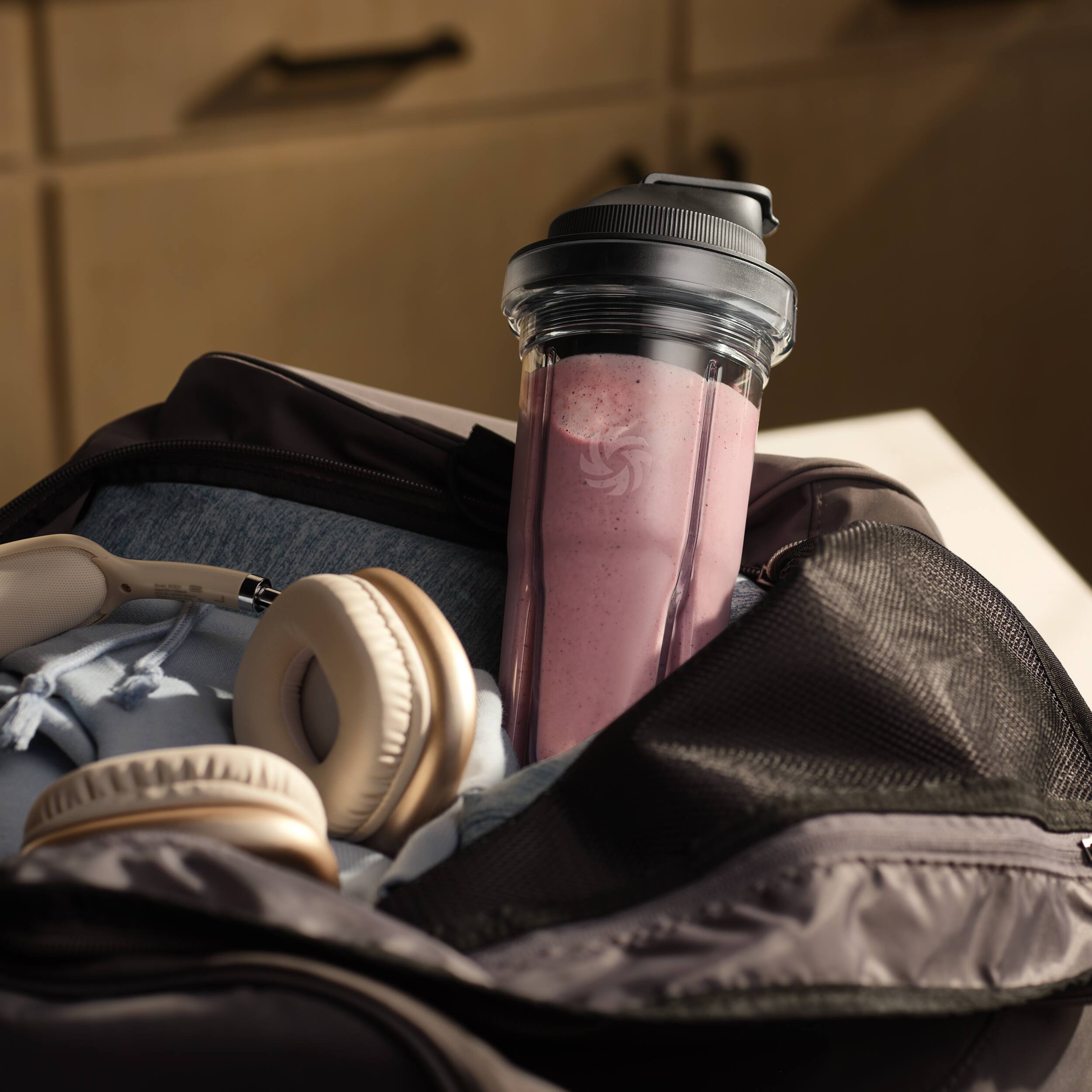 Angle. Vitamix - Blending Cup, 20-Ounce Portable Cup with Travel Lid - Clear.
