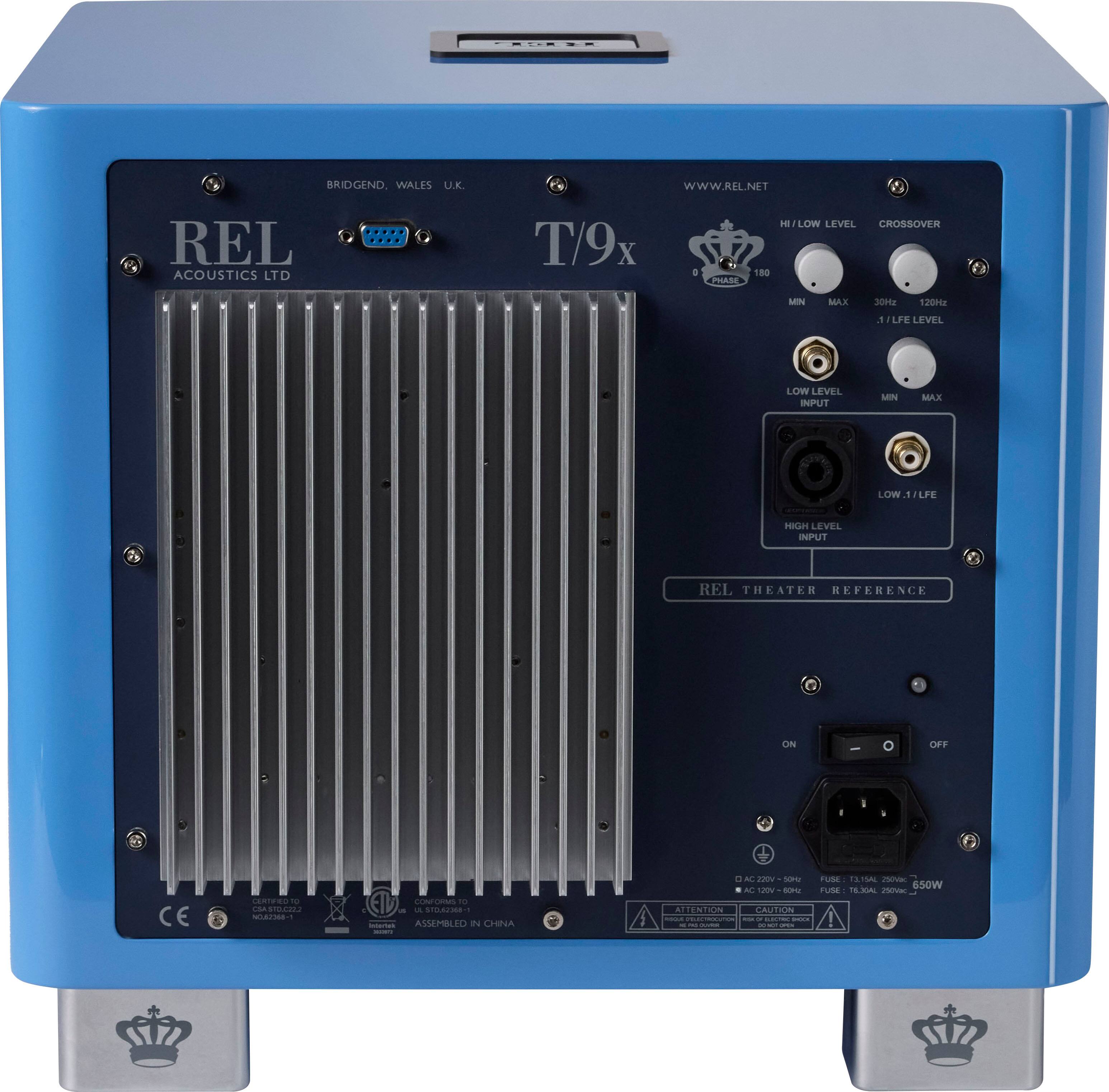REL Acoustics Ltd. is a company that specializes in high-quality audio equipment, including amplifiers and speakers. The image features a blue box with a REL logo on it, indicating that it is a product from this company. The box also has a crown symbol, which is part of the REL branding. The product is designed for use in theaters, providing a high-level crossover and low-level input for optimal audio performance. The box is equipped with various connectors and controls, allowing users to customize their audio experience.