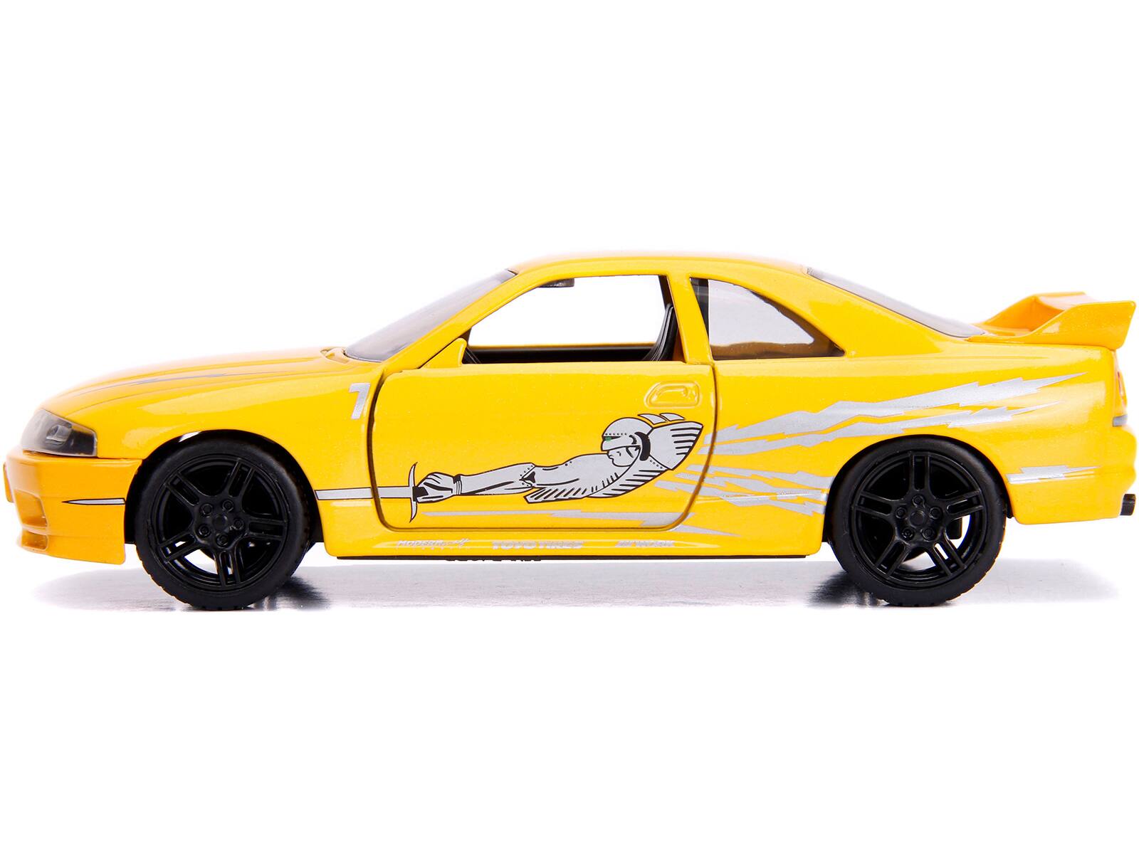 Angle. Jada - Leon's Nissan Skyline GT-R (BCNR33) Yellow Metallic with Graphics "Fast & Furious" Series 1/32 Diecast Model Car by Jada - Yellow Metallic.
