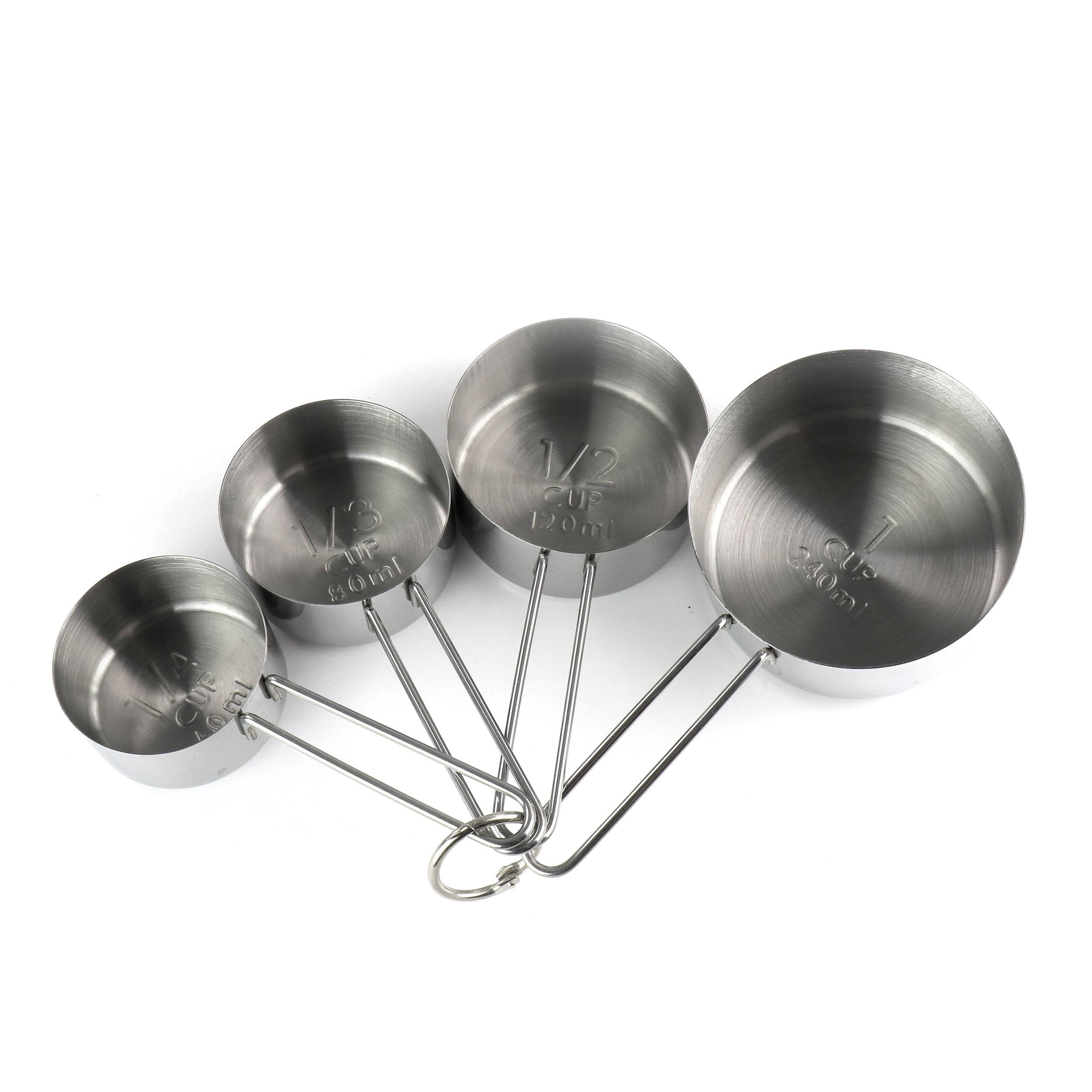 The image features a set of four silver measuring cups, each with a different size. The text on the image reads: 13 ml 1/2 cup 120 ml 7 240 ml cups.