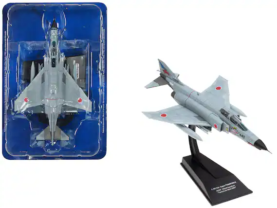 Sure, here is the corrected and grouped text from the image:
---
**Left Side (Packaging):**
- F-4EJ Kai Super PHANTOM II
- JASDF
- Tactical Air Meet 2001
- 1:144 Scale
- Made in China
- Recommended for ages 8 and up
- Product No: 17-8440
- 440
**Right Side (Base):**
- F-4EJ Kai Super PHANTOM II
- JASDF
- Tactical Air Meet 2001
- 1:144 Scale
- 440
---
This text is organized based on the visible information on the packaging and the base of the model.