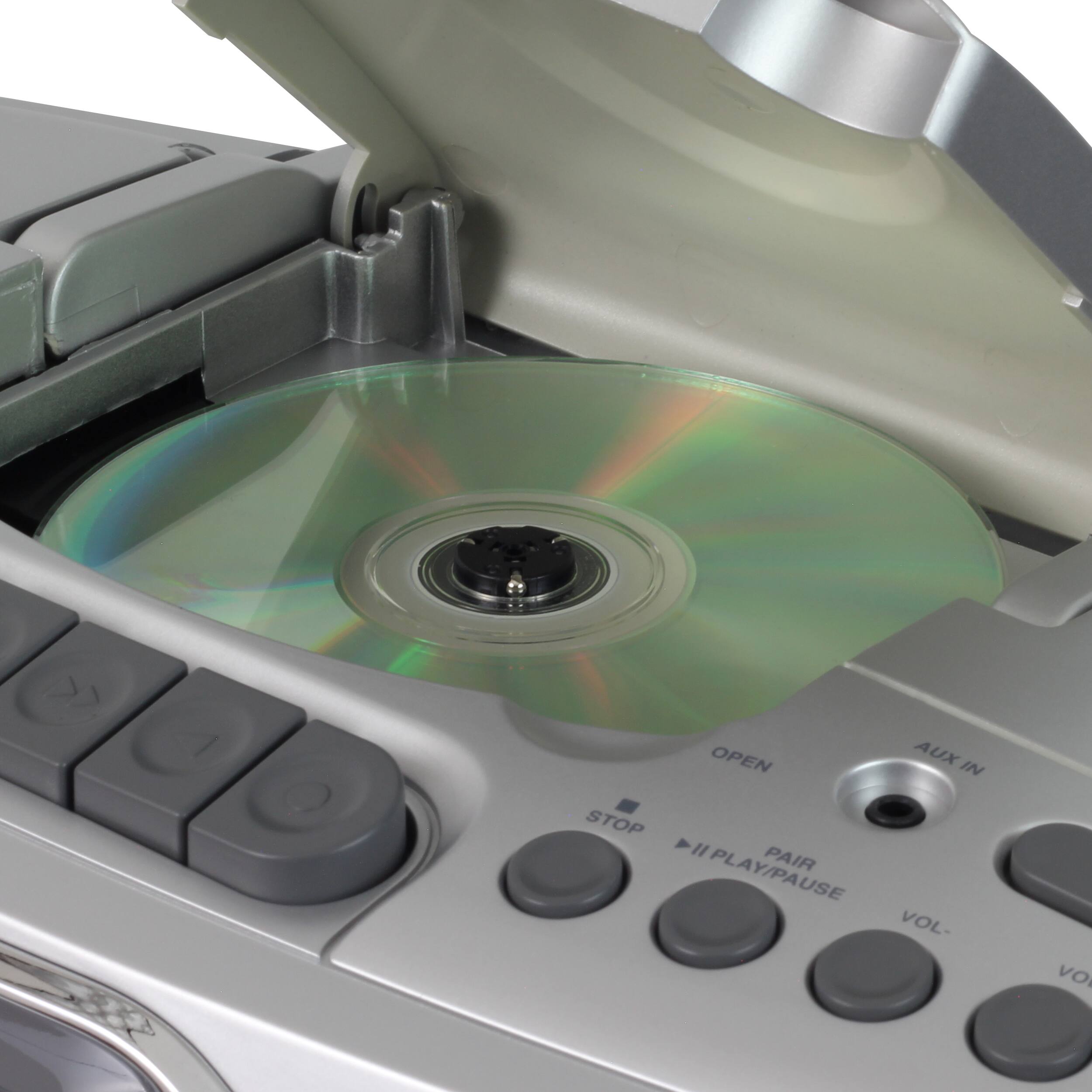 The text on the image reads "OPEN AUX IN STOP 4 "PAIR PLAY/PAUSE VOL- VOLUME".