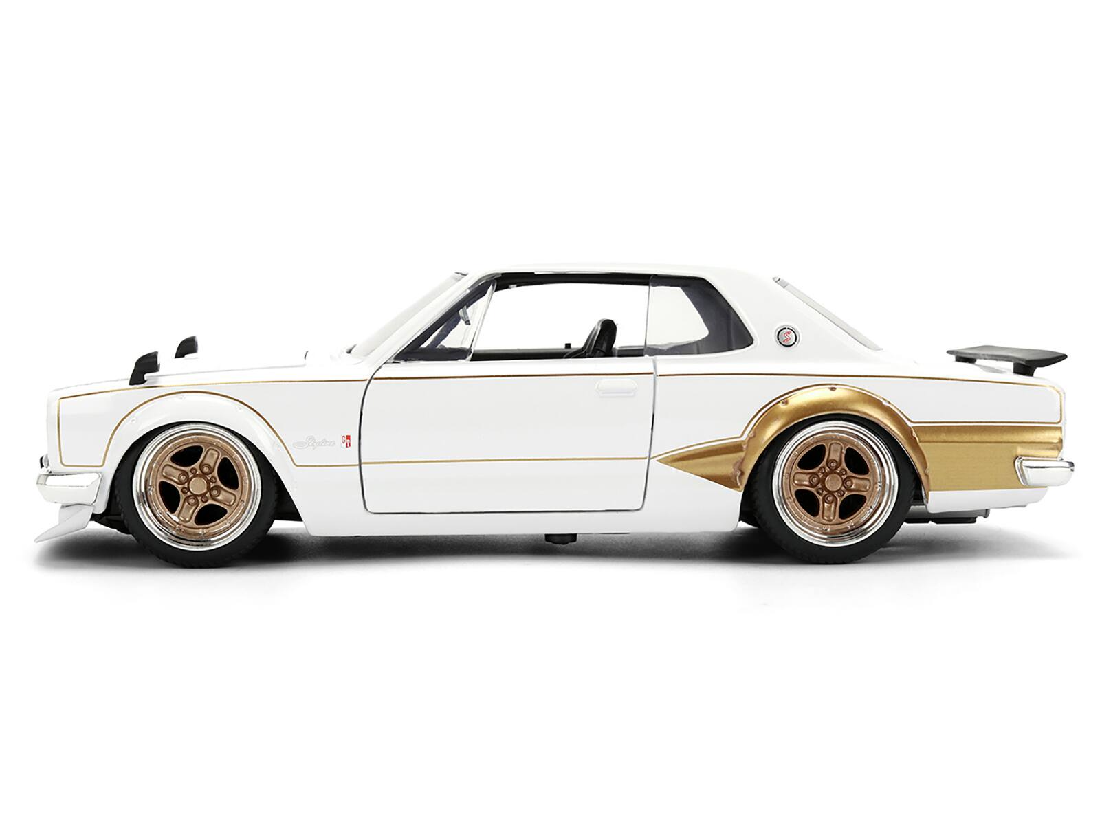 Alt View 2. Jada - 1971 Nissan Skyline 2000GT-R (RHD) White with Gold Graphics "JDM Tuners" 1/24 Die Cast Model Car by Jada - Multicolor.