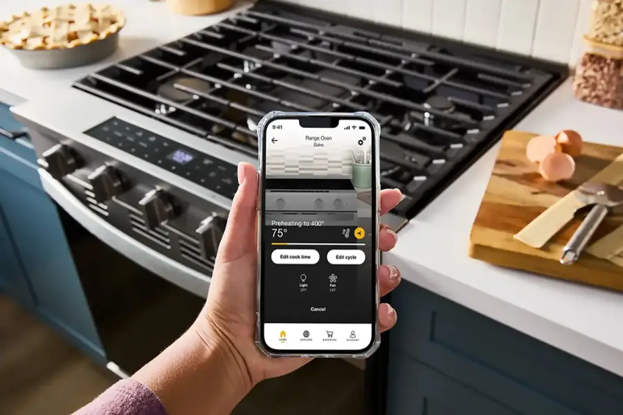 The text on the image reads: "9:41 all Range Oven Bake Preheating to 400 75 Edit cook time Edit cycle Light OFF Fan OFF Cancel - ER SACRRING ASCOUNT."