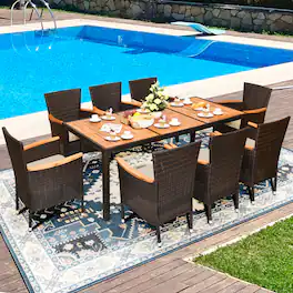Gymax - 9PCS Rattan Patio Dining Set w/ 8 Stackable Cushioned Chairs Wooden Tabletop - Brown