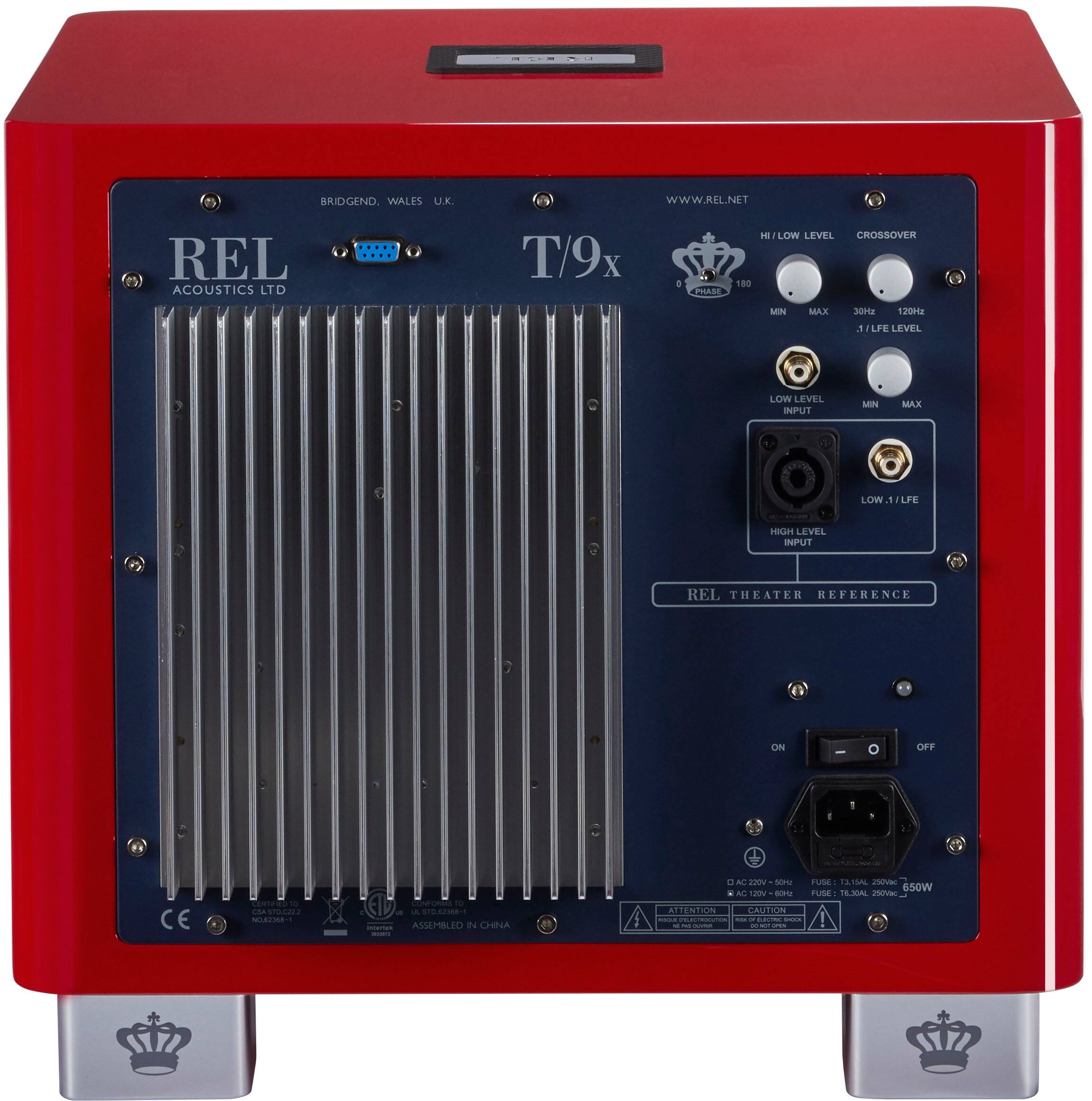 The text on the image reads: "Bridgend Wales L.K. WWW.REL.NET REL Acoustics Ltd T T/9x o PRAISE 180 Hz FLOW LEVEL CROSSOVER MINN MAX 120H2. LFE LEVEL LOW LEVEL INPUT MIN MAX LOW 1 LFE 10A LEVEL INPUT REL THEATER REFERENCE ON/OFF - 1. CE.N NA C.. ASSEMBLED IN CESENA. ITALY. ATTENTION CAUTION - TUSE 650W FUSE RAL ne."