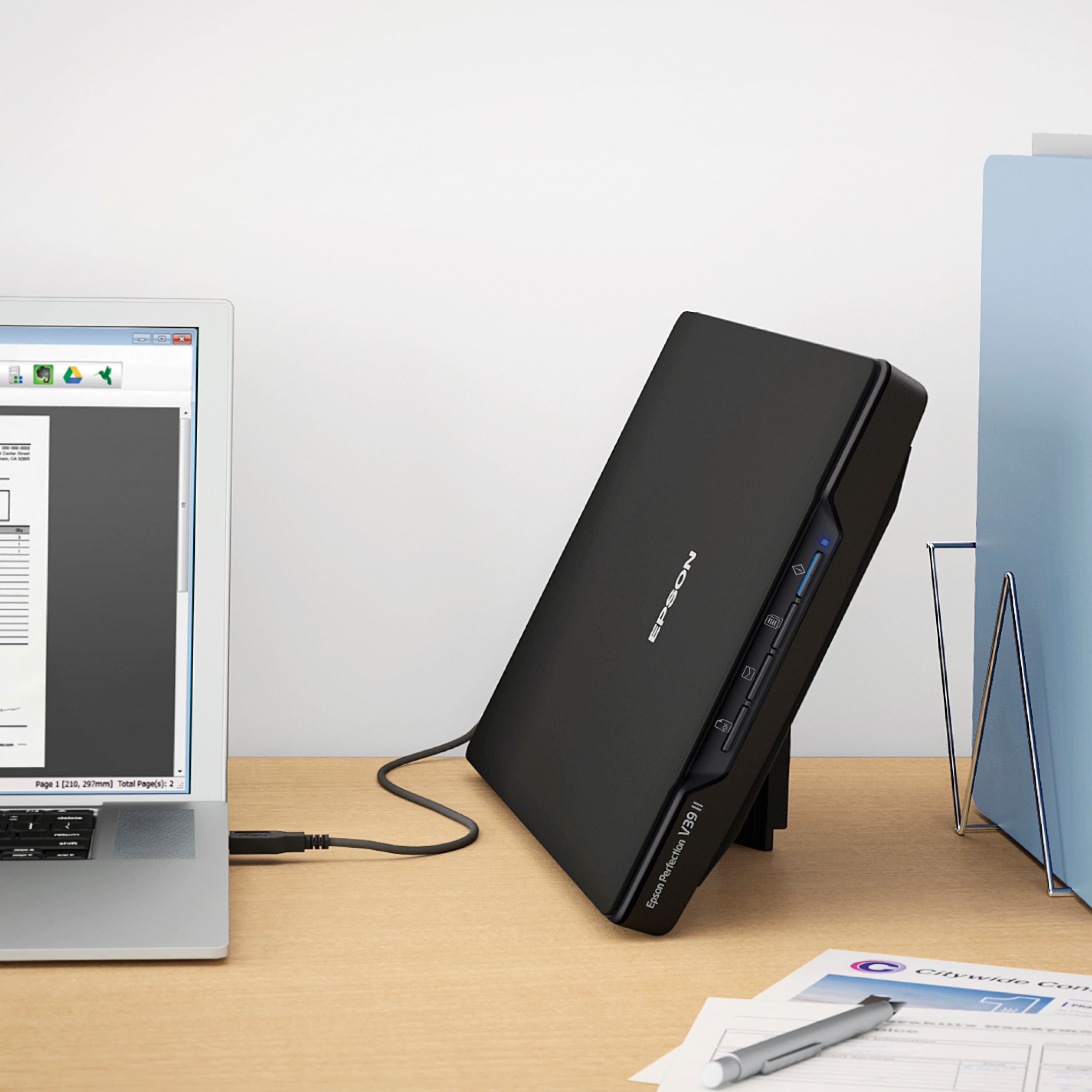 Epson Perfection 1660 Photo printer is a versatile and high-quality printer designed for photo enthusiasts and professionals. It features a built-in scanner and a dedicated photo cartridge, which allows for superior photo printing quality. The printer is connected to a computer, as indicated by the visible cords and the placement of the printer on the desk. The Epson Perfection 1660 Photo printer is a reliable and efficient choice for anyone looking to print high-quality photos with ease.