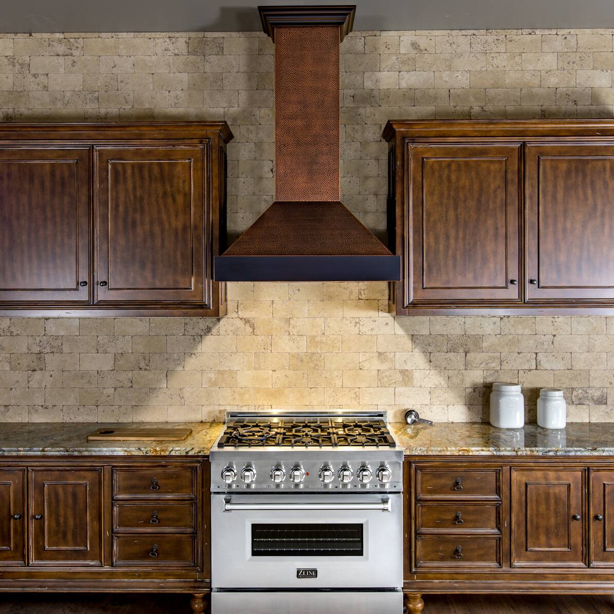 Left. ZLINE - ZLINE 30 in. Convertible Vent Designer Series Wall Mount Range Hood (655-HBXXX-30) - Hand Hammered Copper.