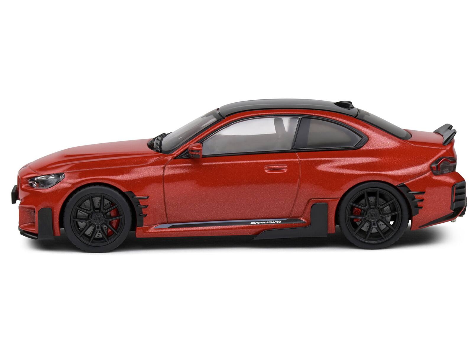 Angle. Solido - 2023 BMW M2 M Performance Toronto Red Metallic with Black Top 1/43 Diecast Model Car by Solido - Red Metallic with Black.