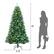 The image shows a woman standing next to a Christmas tree that is 3.1 feet tall. The tree is decorated with blue and green lights.