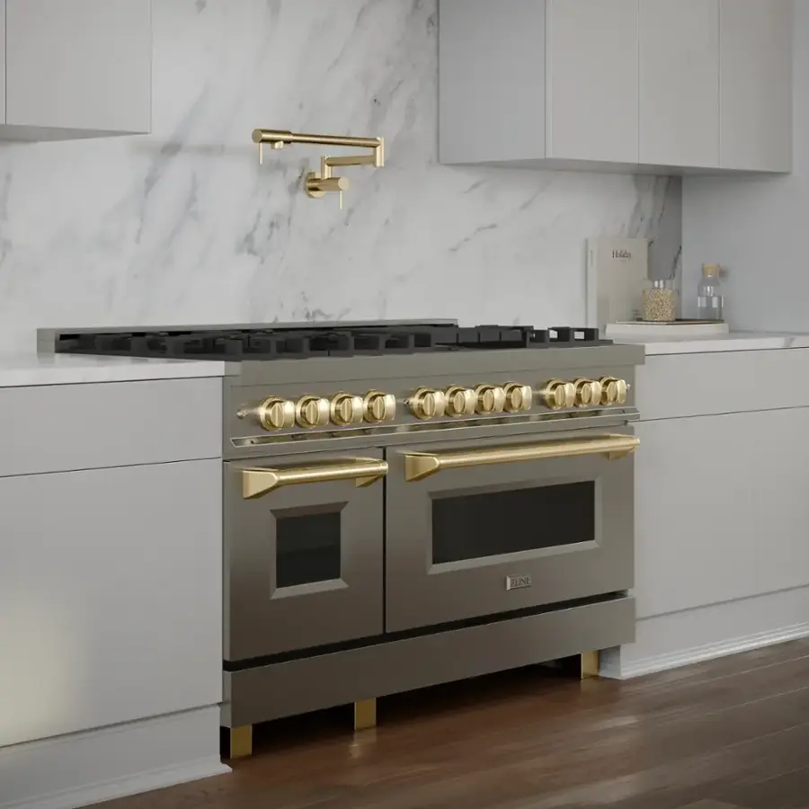 The image features a stainless steel kitchen with a large oven and a sink. The oven is made by ZLINE, and it has a gold knob on the front. The kitchen also includes a faucet and a marble countertop.