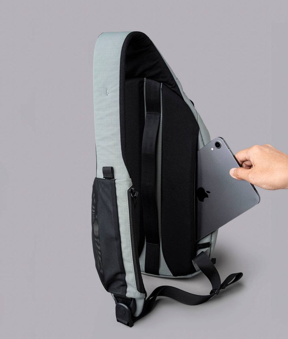Alt View 4. ALPAKA - Crossbody Sling Bag 7.5L (Right Shoulder) for Men, Fits 11" Tablet, Phone Sleeve, Bottle Pocket, Luggage Pass-Through - Grey Axoflux 210D.