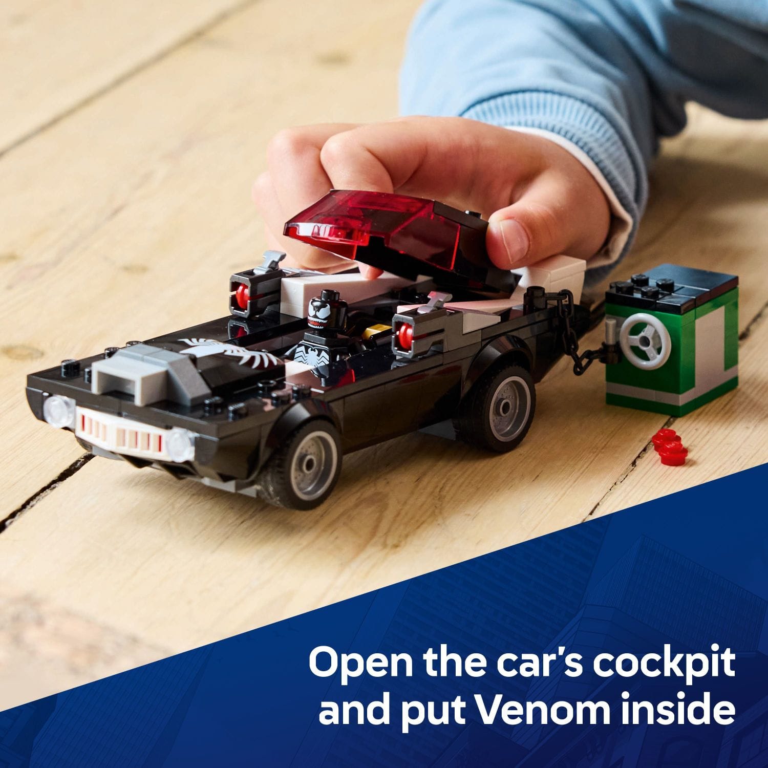 Open the car's cockpit and put Venom inside.