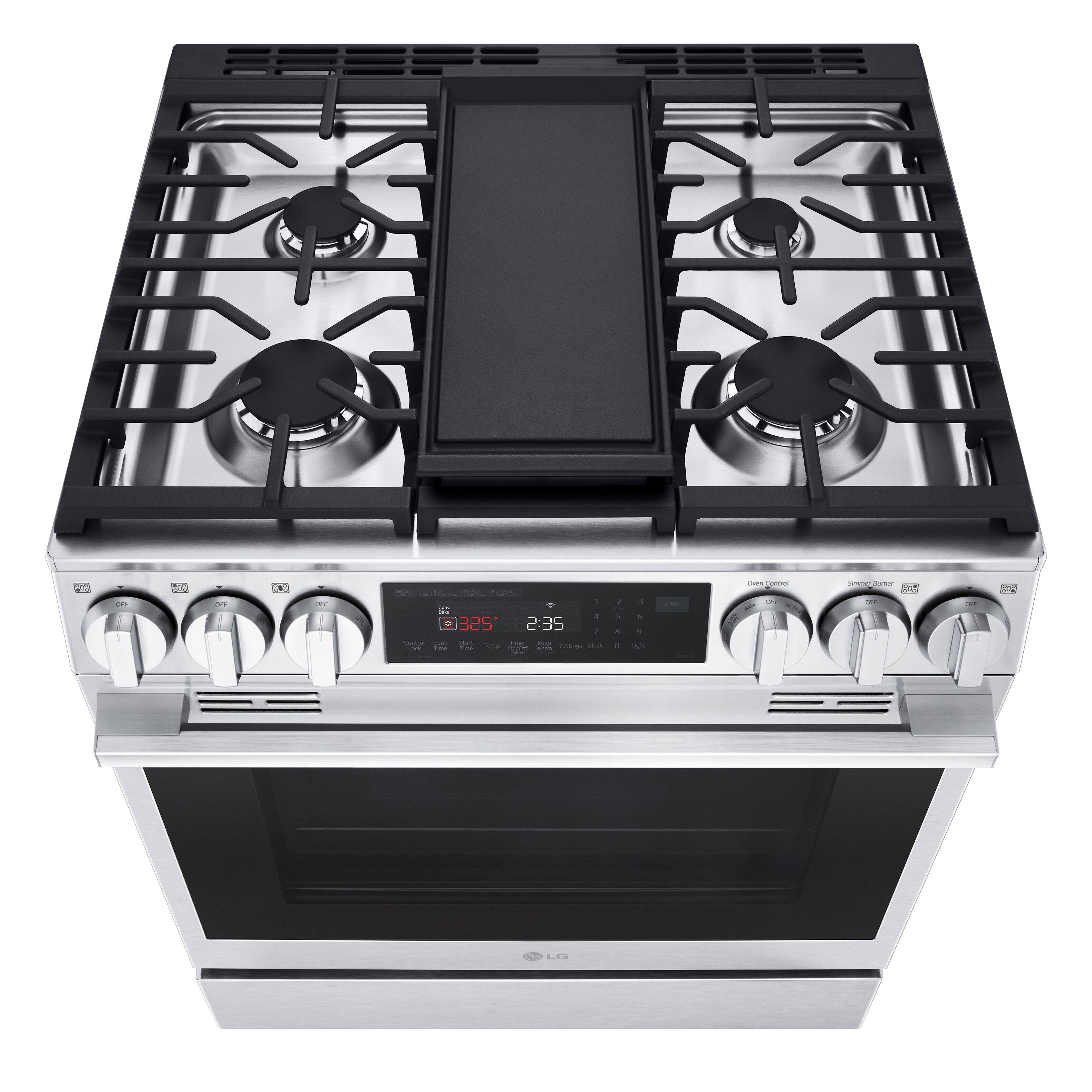 The oven is a stainless steel gas oven with a timer that shows 2:35.