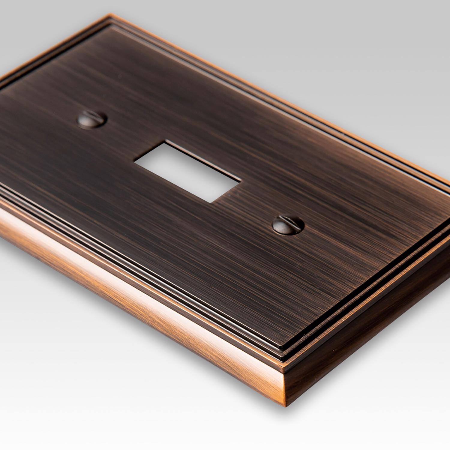 Left. AMERELLE - Amerelle Metro Aged Bronze 1 gang Die-Cast Metal Toggle Wall Plate 1 pk - Bronze.